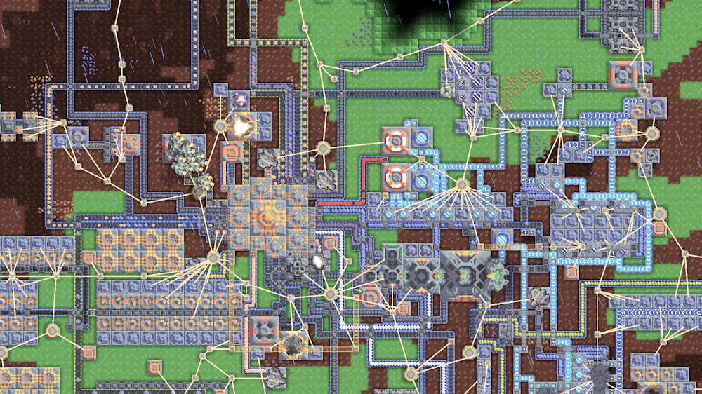Schermata ufficiale di Mindustry: una fabbrica vista dall'alto con decine di nastri trasportatori, trivelle e nodi elettrici che collegano gli impianti su una mappa verde e marrone.